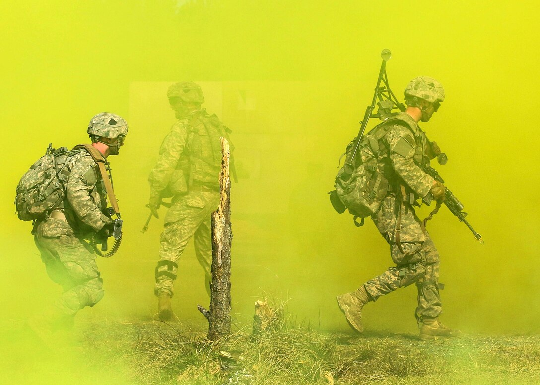 Paratroopers run through smoke to mask their movements while assaulting an objective at the Joint Readiness Training Center’s Peason Ridge on Fort Polk, La., Feb. 13, 2016. Army photo by Staff Sgt. Sean Brady