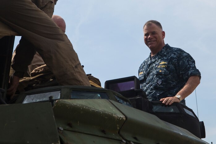 Rear Adm. John B. Nowell smiles at the camera as he exits an AAV-P7/A1 Amphibious Assault Vehicle Feb. 11, 2016, in Hat Yao, Rayong, Thailand. The AAV had just left the USS Ashland (LSD 48) to practice a ship-to-shore mission for Cobra Gold 16. CG16 is a Thai-U.S. co-sponsored exercise that allows partnering nations to improve cohesion between partner militaries and sustain regional security.