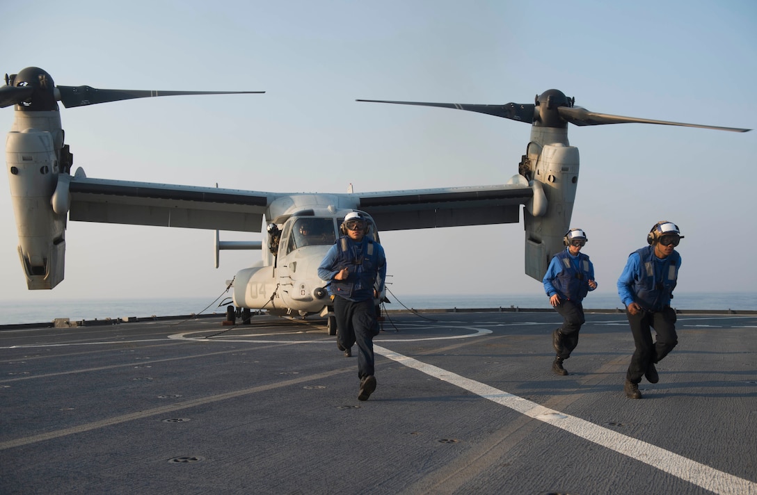 Sailors assigned to amphibious dock landing ship USS Ashland (LSD 48) move to the safe zone after securing MV-22 Osprey aircraft, attached to Marine Medium Tiltrotor Squadron 262 (VMM-262), to the flight deck of Ashland during flight quarters. Ashland is assigned to the Bonhomme Richard Amphibious Ready Group and is participating in Cobra Gold 16, a Thai-U.S. co-sponsored multinational joint exercise designed to advance regional security by exercising a robust multinational force from nations sharing common goals and security commitments in the Indo-Asia-Pacific region.