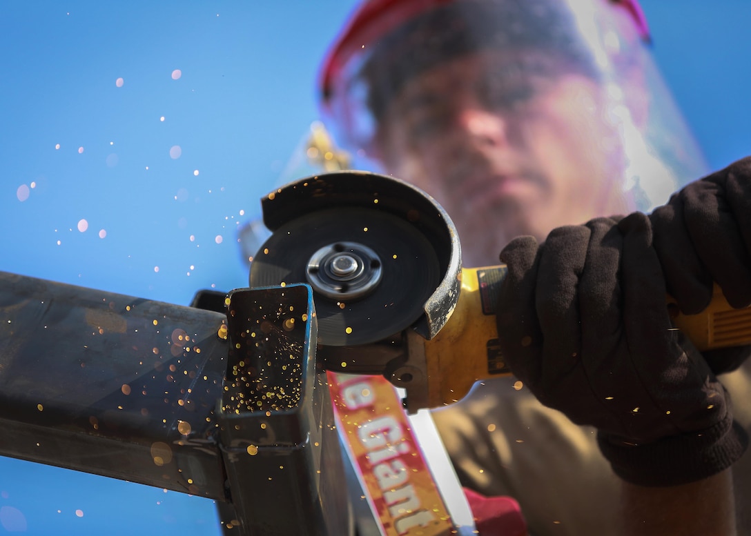 Navy Petty Officer 2nd Class Michael Featherston cuts steel beams during the construction of a community center during exercise Cobra Gold at the Ban Sa Yai School, in Trat, Thailand, Feb. 3, 2016. Featherston is a steel worker assigned to Naval Mobile Construction Battalion 3. Cobra Gold 2016 focuses on humanitarian civic action, community engagement, and medical activities conducted during the exercise to support the needs and humanitarian interests of civilian populations around the region. Marine Corps photo by Lance Cpl. Miguel A. Rosales