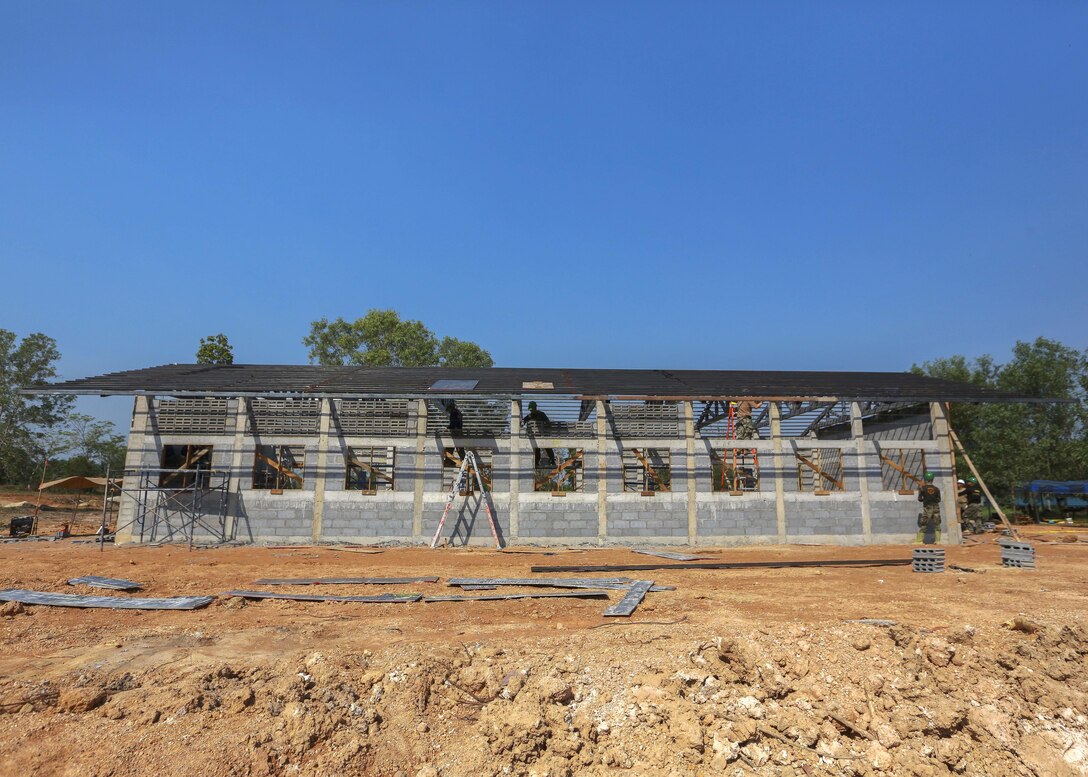 Royal Thai, Malaysia armed forces service members and U.S. sailors work together to build a community center during exercise Cobra Gold at the Ban Sa Yai School, in Trat, Thailand, Feb. 3, 2016. Marine Corps photo by Lance Cpl. Miguel A. Rosales