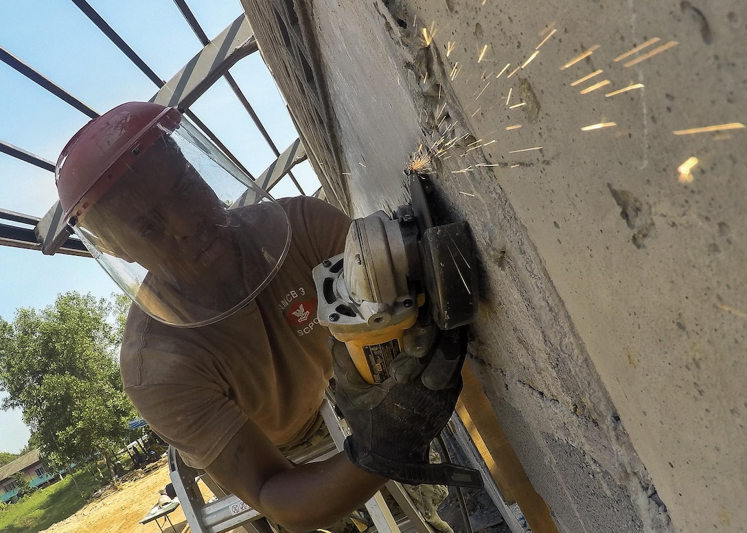Navy Seaman Jason White helps with the construction of a community center during exercise Cobra Gold at the Ban Sa Yai School, in Trat, Thailand, Feb. 3, 2016. White is an engineer aid construction man assigned to Naval Mobile Construction Battalion 3. Marine Corps photo by Lance Cpl. Miguel A. Rosales