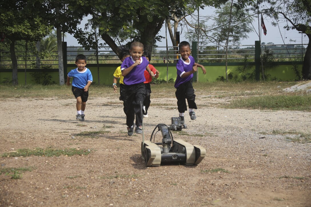 Students from the Kao Chi Chan School play with an irobot 310 SUGV during exercise Cobra Gold in Sattahip, Thailand, Feb. 14, 2016. Cobra Gold is a multinational training exercise developed to strengthen security and interoperability  between the Kingdom of Thailand, the U.S. and other participating nations. 