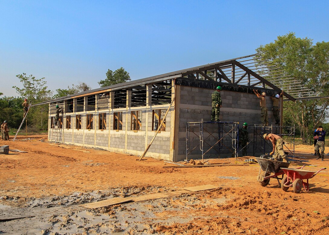 Royal Thai, Malaysia armed forces service members and U.S. sailors work together to build a community center during exercise Cobra Gold at the Ban Sa Yai School, in Trat, Thailand, Feb. 3, 2016. Marine Corps photo by Lance Cpl. Miguel A. Rosales