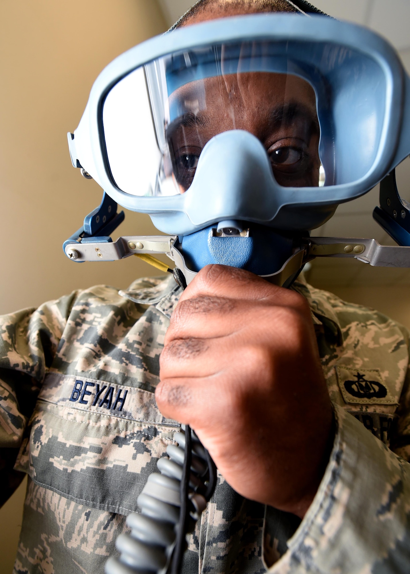 Tech. Sgt. Nafis Beyah, a 386th Expeditionary Operations Support Squadron aircrew flight equipment technician, conducts an operations check on a 358 Quick Don Mask at an undisclosed location in Southwest Asia, Feb. 9, 2016. Beyah is part of a 12-person aircrew flight equipment team supporting Operation INHERENT RESOLVE by ensuring all flight and safety equipment is operational and ready to use. (U.S. Air Force photo by Staff Sgt. Jerilyn Quintanilla) 