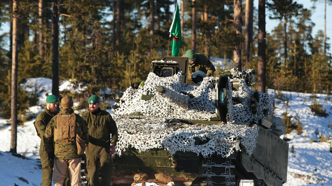 The Norwegian Telemark Battalion instructs U.S. Marine amphibious assault vehicle personnel from 2nd Amphibious Assault Battalion on techniques of driving tracked vehicles in winter conditions on an ice track in Rena, Norway, Feb. 15. In the weeks leading up to exercise Cold Response 16, at the end of the month, the two nations will conduct bilateral training to improve U.S. Marine Corps capability to operate in cold-weather environments.