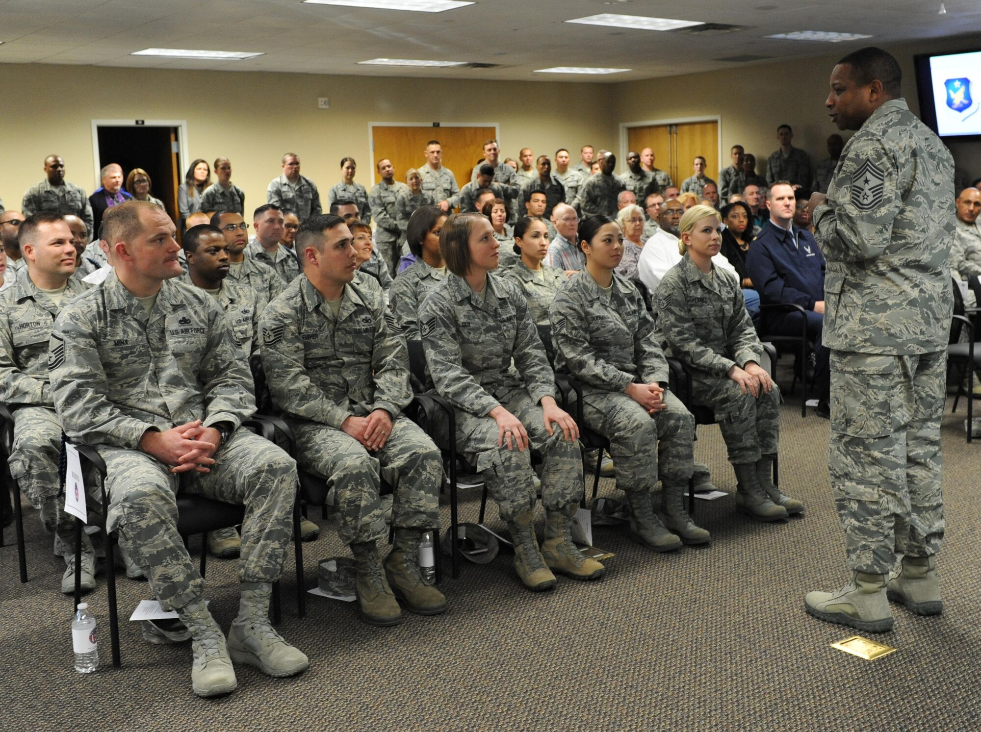 Chief Master Sgt. Farrell Thomas, 2nd Air Force command chief, speaks to students during a graduation ceremony at Lott Hall Feb. 11, 2016, Keesler Air Force Base, Miss. The first selected group of NCOs graduated the military training leader course after attending the nine-day class at Keesler. The program, formerly based out of Joint Base San Antonio-Lackland, Texas, is designed to mentor, train and lead Airmen in technical training as military training leaders. (U.S. Air Force photo by Kemberly Groue)