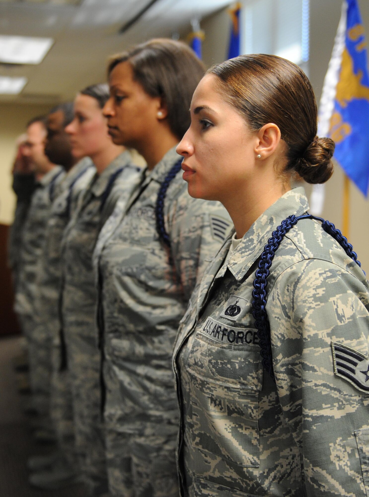 Staff Sgt. Jessica Ventura, 81st Training Support Squadron military training leader course student, stands at attention with class members during a graduation ceremony at Lott Hall Feb. 11, 2016, Keesler Air Force Base, Miss. The first selected group of NCOs graduated the military training leader after attending the nine-day class at Keesler. The program, formerly based out of Joint Base San Antonio-Lackland, Texas, is designed to mentor, train and lead Airmen in technical training as MTLs. (U.S. Air Force photo by Kemberly Groue)