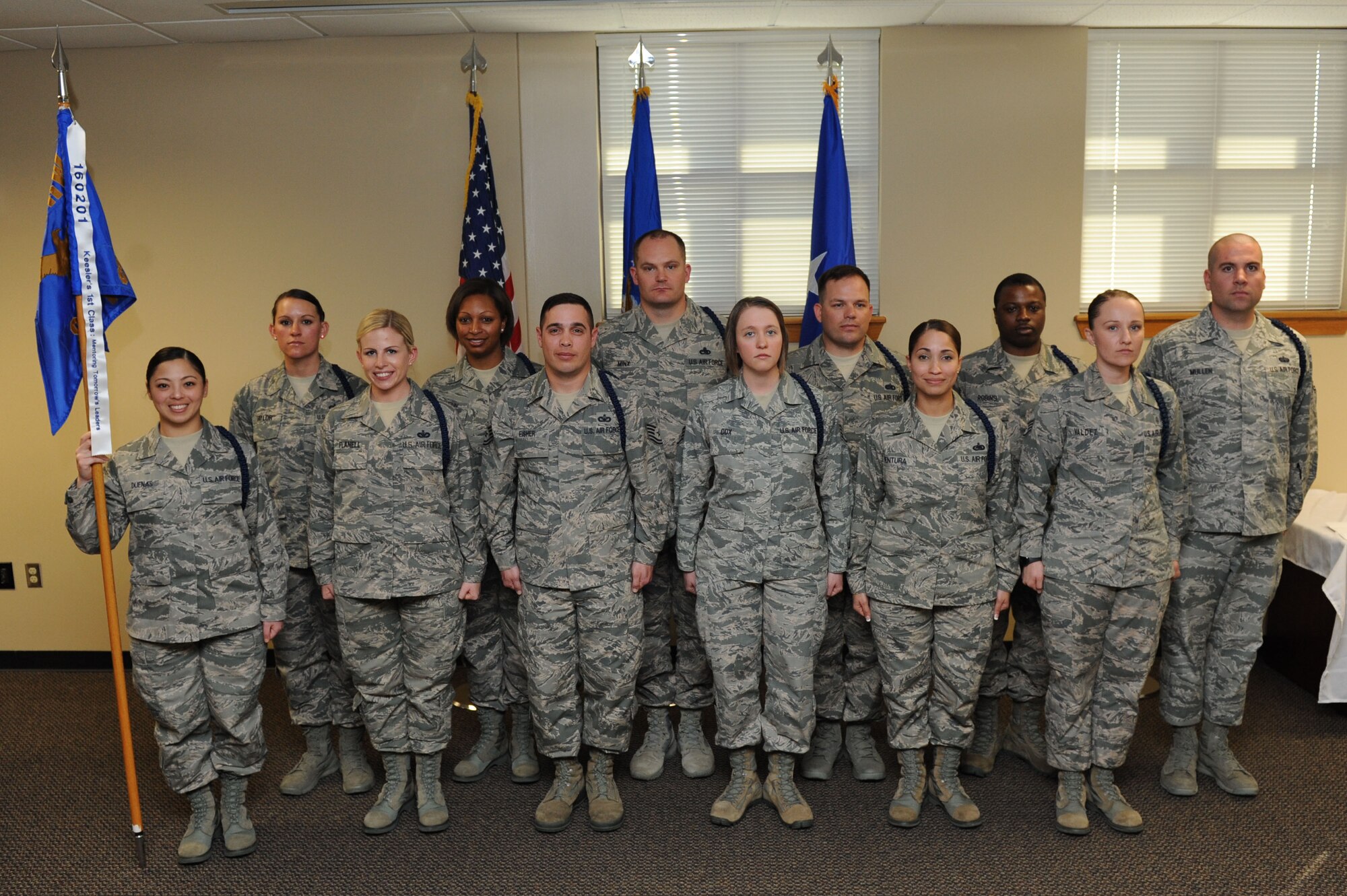 Students from the 81st Training Support Squadron military training leader course  and their instructors take a group photo during a graduation ceremony at Lott Hall Feb. 11, 2016, Keesler Air Force Base, Miss. The first selected group of NCOs graduated the military training leader course after attending the nine-day class at Keesler. The program, formerly based out of Joint Base San Antonio-Lackland, Texas, is designed to mentor, train and lead Airmen in technical training as MTLs. (U.S. Air Force photo by Kemberly Groue)