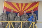 Nashville, Tenn., resident Sgt. Brian Bertram, Glendale, Ariz., resident Sgt. Nicholas Robinson, San Tan Valley, Ariz., resident Cpt. Sherri Gregoire, Tucson, Ariz., resident 1st Sgt. Trevor Varney, and Phoenix resident Sgt. 1st Class Kevin Stockard gather outside their company headquarters for Company F, 1st Battalion, 168th Air Traffic Services, 40th Combat Aviation Brigade, at Camp Buehring Kuwait, Feb. 8. Capt. Gregoire and 1st Sgt. Varney are the command team for Company F, which provides Air Traffic Services for all friendly aviation assets. (Photo by 1st Lt. Aaron DeCapua, 40th Combat Aviation Brigade Public Affairs)