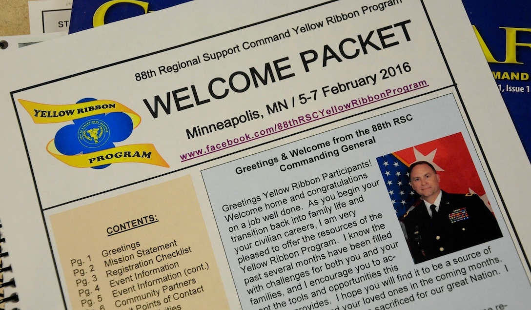 The 88th Regional Support Command Yellow Ribbon Reintegration Program Event attendees receive Welcome Packets as they check-in at the event in Minneapolis, Minn., Feb. 5, 2016. The packets includes staff contact information, training class schedules, information and guidance on services such as youth activities, travel and hotel reservations, and what to do in case of an emergency or illness. Maj. Gen. Patrick Reinert also includes a personal greeting to service members and their families.