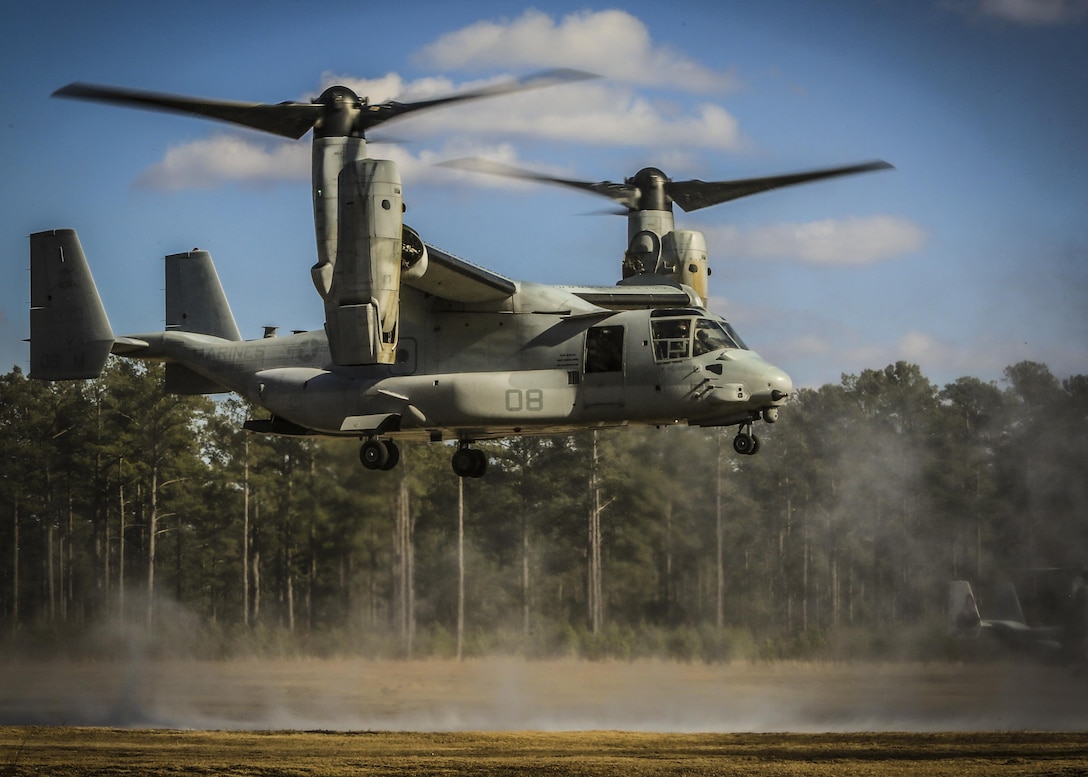 Maj. Steven R. Huls and Capt. Edward K. Williams navigate a MV-22B Osprey into a landing zone during section confined area landings near Marine Corps Air Station New River, N.C., Feb. 10, 2016. Marines with VMM-365 flew to a landing zone, which allowed pilots to practice CALs in their Osprey’s and then flew several miles off the coast to practice their proficiency with shooting the M2 Browning .50-caliber machine gun. Huls and Williams are pilots with Marine Medium Tiltrotor Squadron 365. (U.S. Marine Corp photo by Lance Cpl. Aaron K. Fiala/Released)