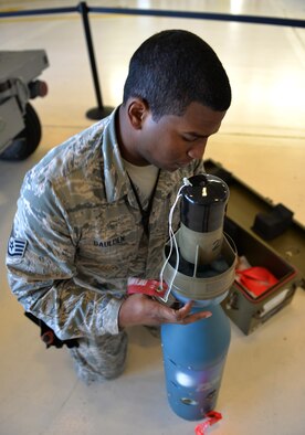 Staff Sgt. Timothy Gaulden, a 33rd Aircraft Maintenance Squadron weapons load crew chief, inspects a joint direct attack munition for the first F-35A Lightning II load competition at Eglin Air Force Base, Fla., Feb. 5, 2016. This was the first competition hosted at the 33rd Fighter Wing in seven years. (U.S. Air Force photo/Senior Airman Andrea Posey)