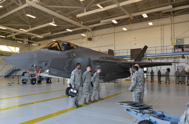 Load crew members from the 33rd Aircraft Maintenance Squadron prepare to participate in the first annual F-35A Lightning II load competition at Eglin Air Force Base, Fla., Feb. 5, 2016. The 33rd Fighter Wing hosted four quarterly load competitions where Airmen competed to qualify for the event. (U.S. Air Force photo/Senior Airman Andrea Posey)