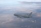 A KC-46A Pegasus refuels an F/A-18 Hornet with its hose and drogue system. (Boeing photo/John Parker)
