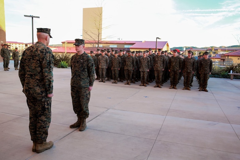 Cpl. Corey Mount is recognized by Lt. Gen. David Berger as the I Marine Expeditionary Force Marine of the Year during a ceremony at Camp Pendleton Feb. 10, 2016. The award recognizes a Marine who exceeds expectations and embodies the spirit and ideals of the Marine Corps. Berger is the I MEF commanding general and Mount, a native of Indianapolis, is an administrative noncommissioned officer with 1st Reconnaissance Battalion, 1st Marine Division, I MEF. (U.S. Marine Corps photo by Lance Cpl. Caitlin Bevel)