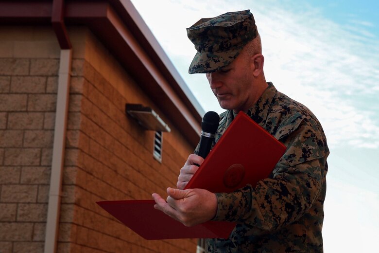 Sgt. Maj. Bradley Kasal reads the award citation naming Cpl. Corey Mount as the I Marine Expeditionary Force Marine of the Year during a ceremony at Camp Pendleton Feb. 10, 2016. The award recognizes a Marine who exceeds expectations and embodies the spirit and ideals of the Marine Corps. Kasal, a native of Marengo, Iowa, is the I MEF sergeant major and Mount, a native of Indianapolis, is an administrative noncommissioned officer with 1st Reconnaissance Battalion, 1st Marine Division, I MEF. (U.S. Marine Corps photo by Lance Cpl. Caitlin Bevel)