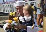 160212-N-LY160-245 PEARL HARBOR (Feb. 12, 2016) Machinist’s Mate 2nd Class Noah Huston of Port Orchard, Wash., is reunited with his 5-year-old daughter, Alice, 2-year-old  daughter, Lucy and wife, Ana, following the return of the Los Angeles-class fast attack submarine USS City of Corpus Christi (SSN 705) to Pearl Harbor, after completing a successful 5-month Indo-Asia-Pacific deployment. (U.S. Navy photo by Mass Communication Specialist 2nd Class Michael H. Lee/Released)