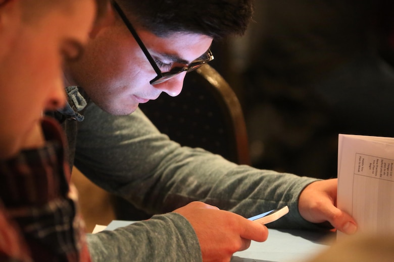 Lance Cpl. Benjamin Alfaro utilizes his mobile phone for an interactive exercise during a Single Marine and Sailor Personal Growth Retreat in New Bern, N.C., Jan. 29-30, 2016. Marines and Sailors from across 2nd Marine Aircraft Wing gathered for a detailed seminar that encompassed basic skills like coping with stress, relationship building and self-awareness. The seminar was led by chaplains with 2nd MAW and focused on helping Marines and Sailors grow as individuals to get them mentally ready for forward deployment and to promote self-improvement.  Alfaro is an electric refrigeration mechanic with Marine Aerial Refueler Transport Squadron 252. (U.S. Marine Corps photo by Cpl. N.W. Huertas/Released) 