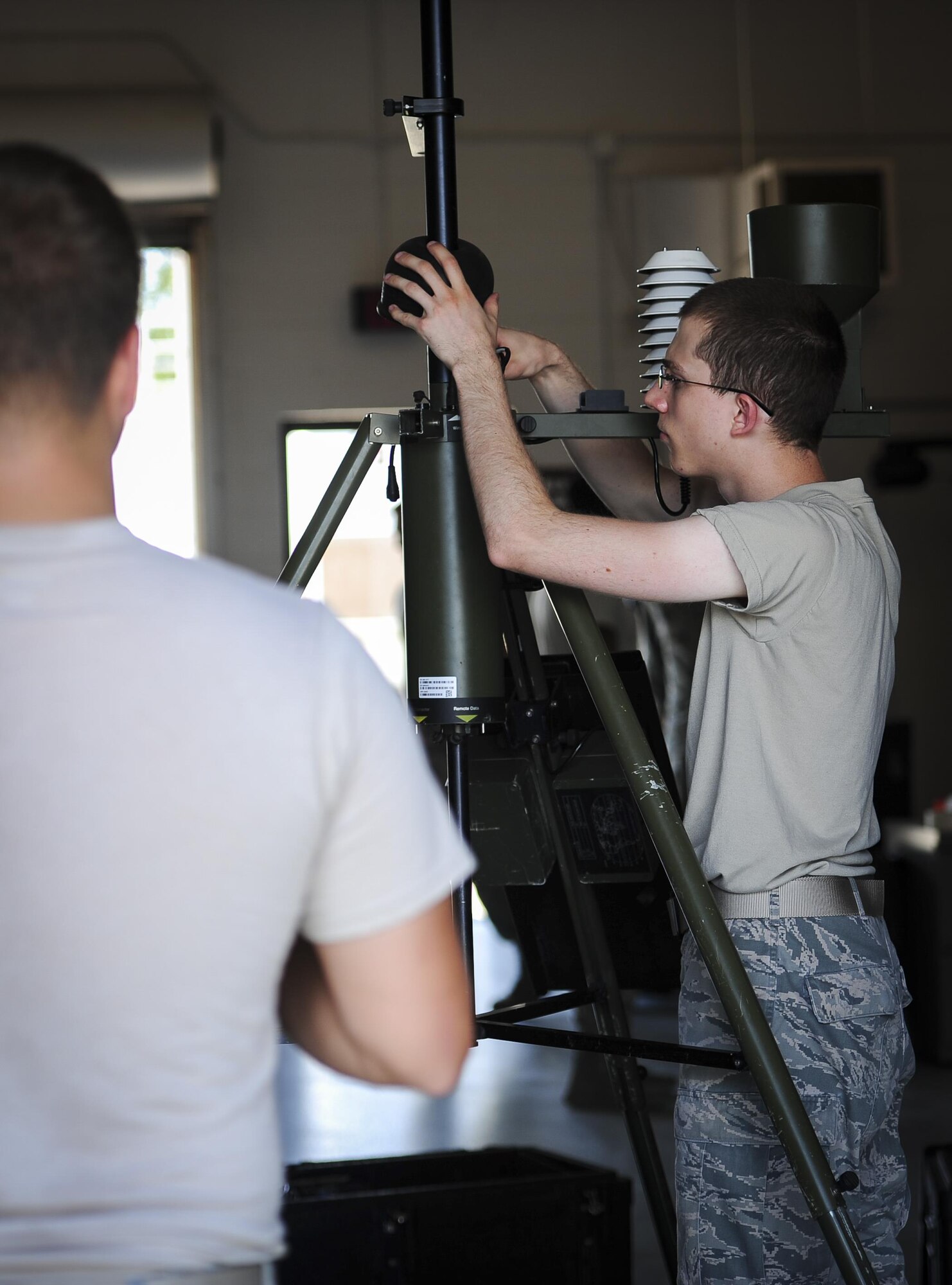 Senior Airman Andrew Jenner, a weather systems technician with the 2nd Combat Weather Systems Squadron, teaches troubleshooting techniques to deploying weather students at Hurlburt Field, Fla., July 21, 2015. 2 CWSS is the Air Force’s primary facility to test and evaluate new and existing tactical and fixed weather systems, train Airmen on tactical systems prior to deployment and provide manpower for the Weather Systems Support Cadre. (U.S. Air Force photo by Senior Airman Meagan Schutter)