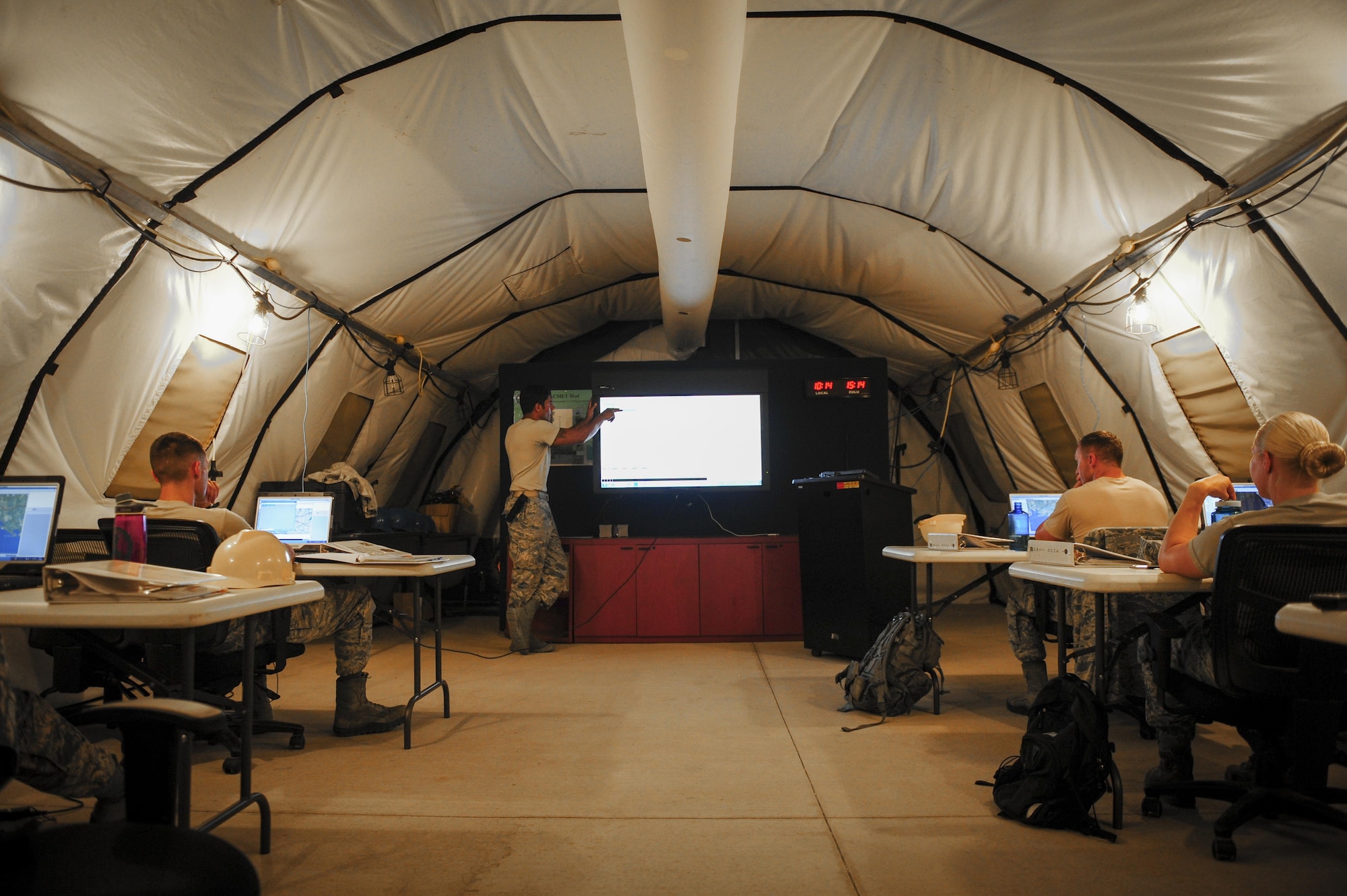 Senior Airman Robert Wyka, a weather systems technician with the 2nd Combat Weather Systems Squadron, inspects the assembly of a TMQ-53 weather system with Senior Airman Cody Stebbis, a weather Airman from Ft. Carson, Colo., during pre-deployment training at Hurlburt Field, Fla., July 21, 2015. 2 CWSS is the Air Force’s primary facility to test and evaluate new and existing tactical and fixed weather systems, train Airmen on tactical systems prior to deployment and provide manpower for the Weather Systems Support Cadre. (U.S. Air Force photo by Senior Airman Meagan Schutter)