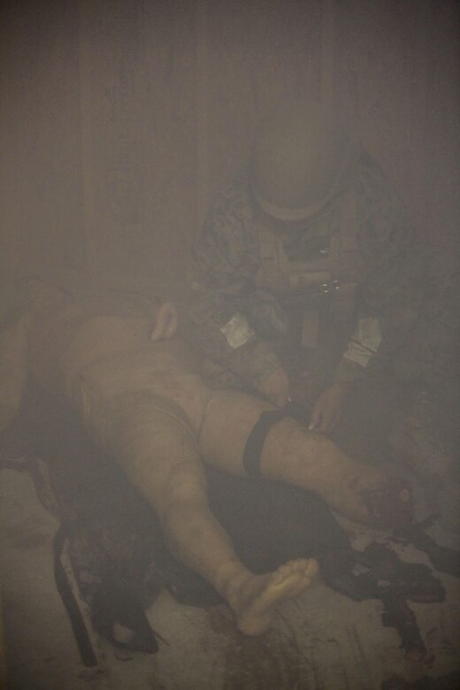 U.S. Navy Seaman Andre Hall, a hospitalman with 2nd Medical Battalion, locates a casualty during a tactical combat casualty care exercise at Camp Lejeune, N.C., Feb. 12, 2016. Sailors were challenged by a chaotic environment of smoke and loud, sporadic noises. (U.S. Marine Corps photo by Cpl. Paul S. Martinez/Released)