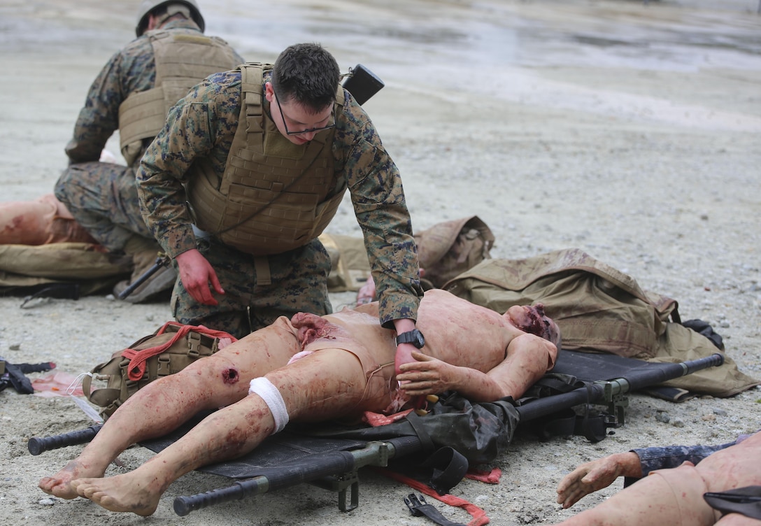 U.S. Navy Petty Officer Second Class Aaron Matthess, a hospital corpsman with 2nd Medical Battalion, treats a casualty during a tactical combat casualty care exercise at Camp Lejeune, N.C., Feb. 12, 2016. The extent of the injuries sailors had to treat on their patients included penetrating chest trauma, shrapnel penetration, amputation, airway obstructions and facial trauma. (U.S. Marine Corps photo illustration by Cpl. Paul S. Martinez/Released)