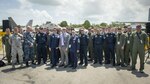 Gen. Lori J. Robinson, Pacific Air Forces commander, Chief Master Sgt. Harold Hutchison, Pacific Air Forces command chief, and the U.S. Ambassador to Singapore, Kirk Wagar, pose for a group picture in front of two F-22 Raptors with U.S. Airmen, Sailors and Marines supporting the U.S. aircraft displays and aerial demonstration teams supporting the Singapore International Airshow, at Changi International Airport Singapore, Feb. 16, 2016. Throughout the week, U.S. service members are showcasing a variety of U.S. aircraft. Of particular note, this year marks the first time the F-22A Raptor, the U.S. Air Force’s premier 5th generation air dominance fighter, will be displayed at the show. (U.S. Air Force photo by Capt. Raymond Geoffroy/Released)