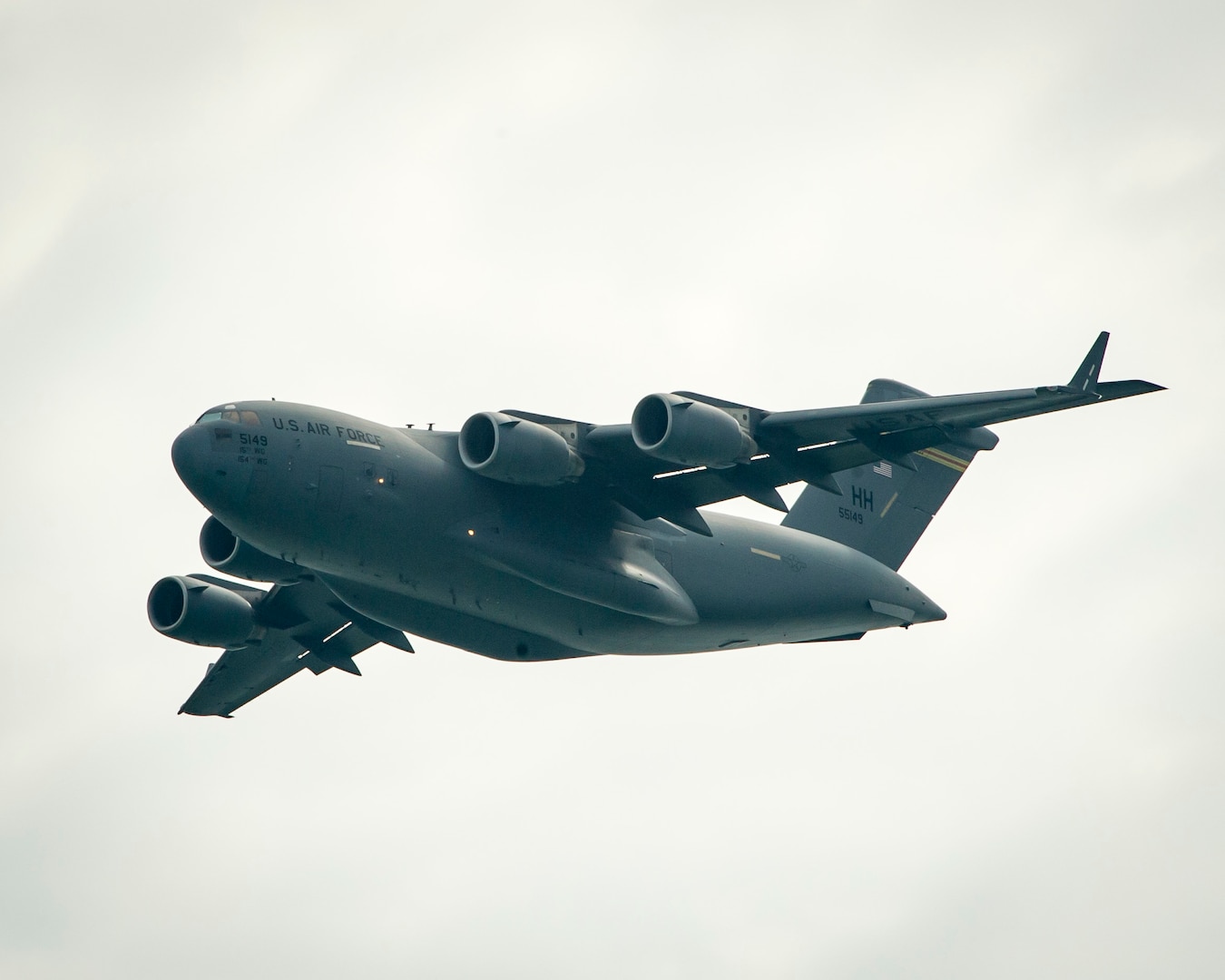 A U.S. Air Force C-17 Globemaster III from the 15th Wing at Joint Base Pearl Harbor-Hickam, Hawaii, practices its aerial demonstration routine prior to the Singapore International Airshow, at Changi International Airport Singapore, Feb. 15, 2016. Through participation in airshows and regional events, the U.S. demonstrates its commitment to the security of the Indo-Asia-Pacific region, promotes equipment interoperability, displays the flexible combat capabilities of the U.S. military, and creates lasting relationships with international audiences to strengthen the bonds that support partnership building throughout the Indo-Asia-Pacific region. (U.S. Air Force photo by Capt. Raymond Geoffroy/Released)