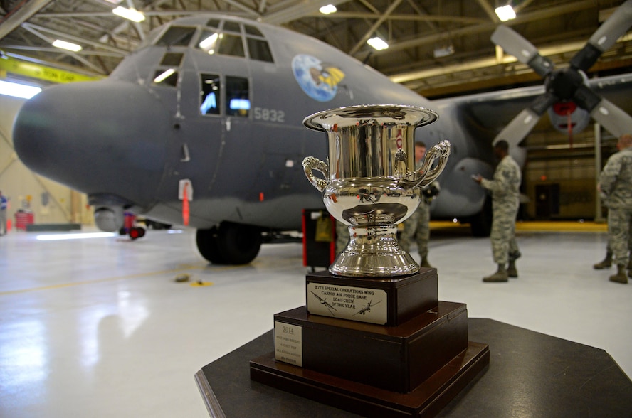 The 27th Special Operations Wing load crew of the year trophy sits atop a display table in the competition arena Feb. 5, 2016, at Cannon Air Force Base, N.M. Cannon’s elite weapons troops came together for the second consecutive year to display load capabilities and precision. (U.S. Air Force photo/Staff Sgt. Alexx Pons) 