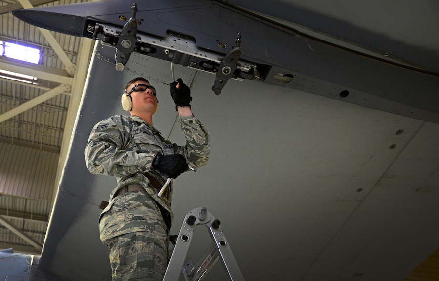 Airman 1st Class Dylan Yarish, 27th Special Operations Maintenance Squadron AC-130W armament unit, makes load preparations to a MAU-40 bomb rack Feb. 5, 2016, at Cannon Air Force Base, N.M. Weapons troops provided a real-time look into career field precision during the second consecutive competition. (U.S. Air Force photo/Staff Sgt. Alexx Pons) 