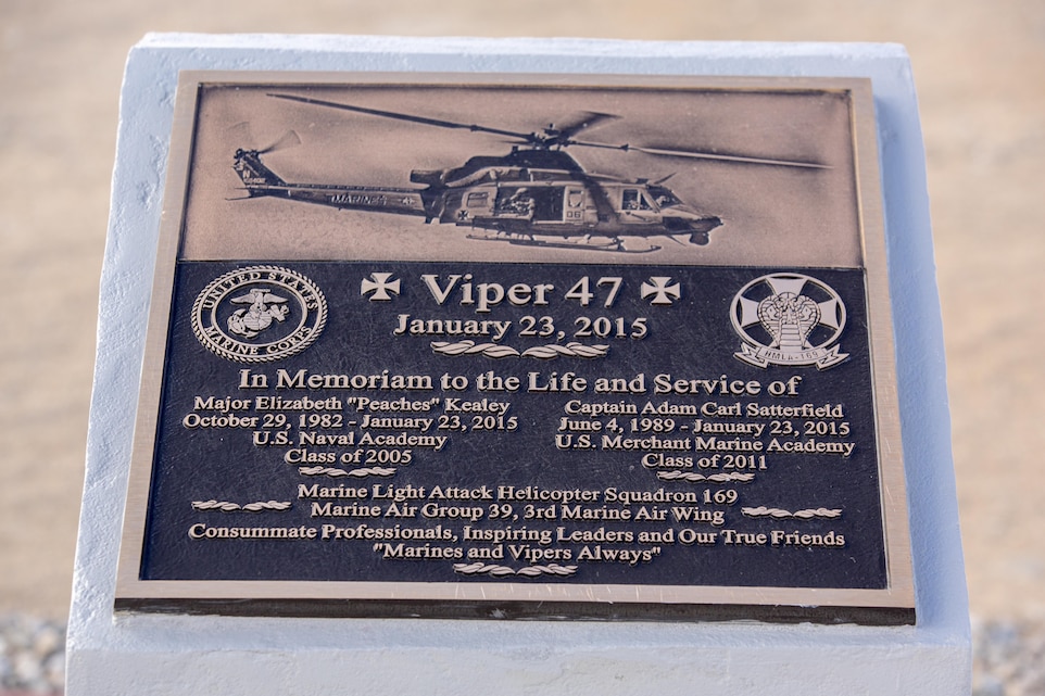 A plaque rests atop a memorial for two pilots with Marine Light Attack Helicopter Squadron 169, who passed away following a mishap last year; at the Strategic Expeditionary Landing Field, Jan. 23, 2016. Marine Wing Support Squadron 374 completed the memorial in time to be unveiled on the anniversary of the incident. (Official Marine Corps photo by Lance Cpl. Levi Schultz/Released)