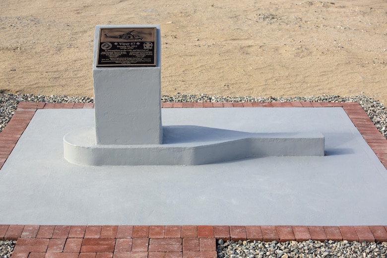 A memorial for two pilots with Marine Light Attack Helicopter Squadron 169, who passed away following a mishap last year; stands at the Strategic Expeditionary Landing Field, Jan. 23, 2016. Marine Wing Support Squadron 374 completed the memorial in time to be unveiled on the anniversary of the incident. (Official Marine Corps photo by Lance Cpl. Levi Schultz/Released)