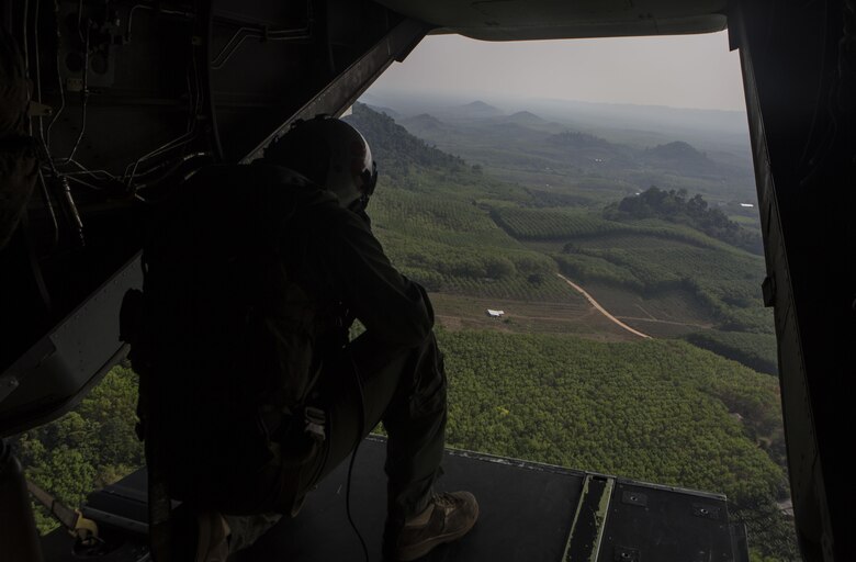 Sgt. Eric M. Ekelund prepares an MV-22B Osprey to land the tactical recovery of aircraft and personal force during a Cobra Gold 16 demonstration at Utapao, Thailand February 15. During the scenario-based training the MV-22B Osprey unloads the TRAP force personnel so they can continue on foot to rescue the simulated casualty. Cobra Gold is a multi-national exercise that focuses on increasing relationships and capabilities of participating countries by training to form solutions to common challenges. Ekelund, from Bay Shore, New York is with Marine Medium Tiltrotor Squadron 262, Marine Aircraft Group 36, 1st Marine Aircraft Wing, III Marine Expeditionary Force. 