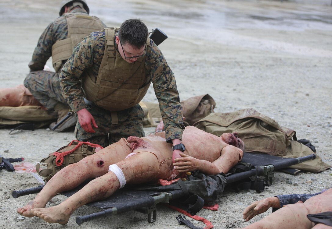 U.S. Navy Petty Officer Second Class Aaron Matthess, a hospital corpsman with 2nd Medical Battalion, treats a casualty during a tactical combat casualty care exercise at Camp Lejeune, N.C., Feb. 12, 2016. The extent of the injuries sailors had to treat on their patients included penetrating chest trauma, shrapnel penetration, amputation, airway obstructions and facial trauma. (U.S. Marine Corps photo illustration by Cpl. Paul S. Martinez/Released)
