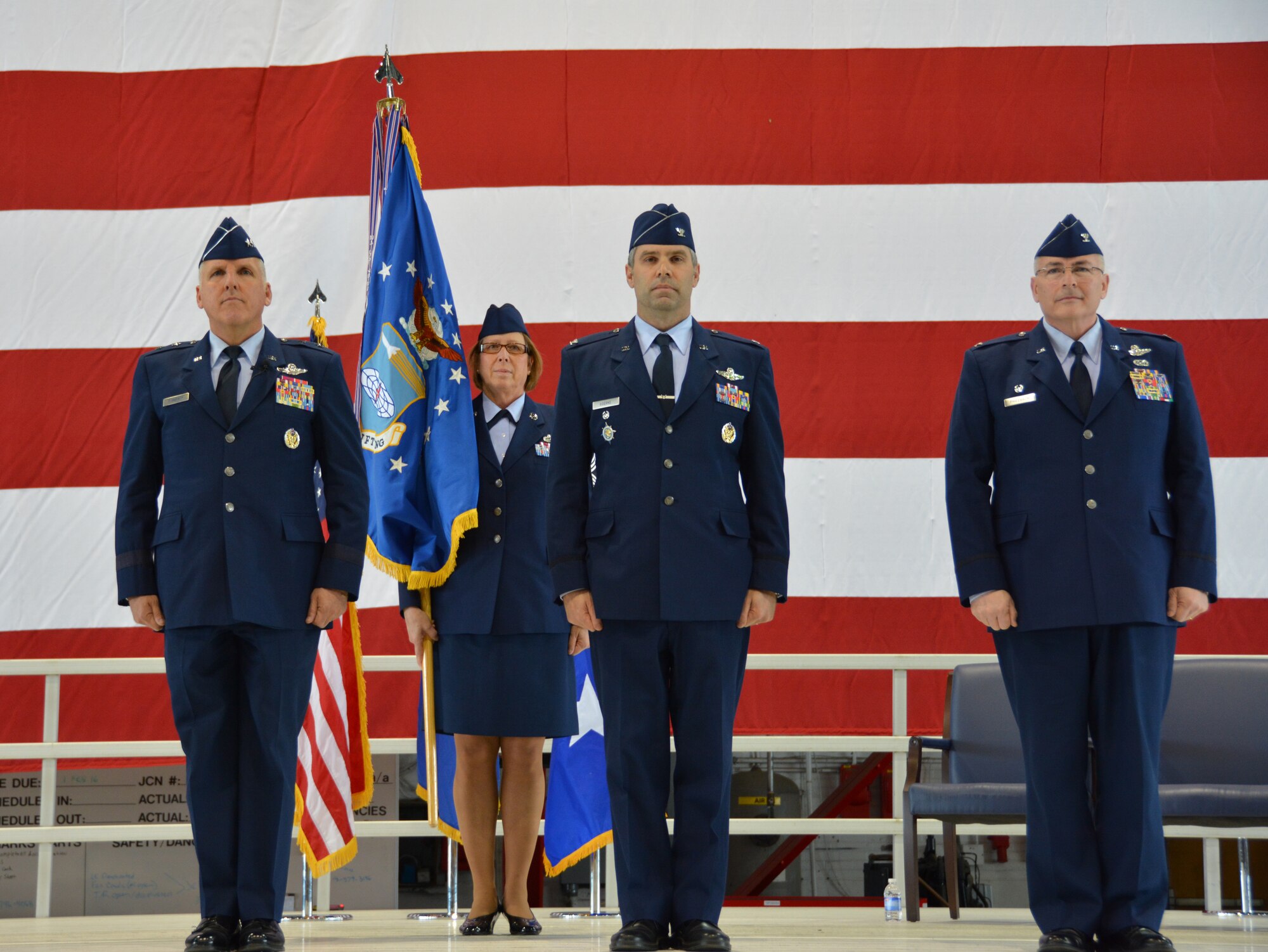 Maj. Gen. John Flournoy, Chief Master Sgt. Vicky Kuntz, Col. Karl Goerke and Col. Jonathan Philebaum stand ready for the official passing of the guidon during the 932d Airlift Wing's change of command ceremony at Feb.7, 2016. (U.S. Air Force photo by Tech. Sgt. Jodi Ames)