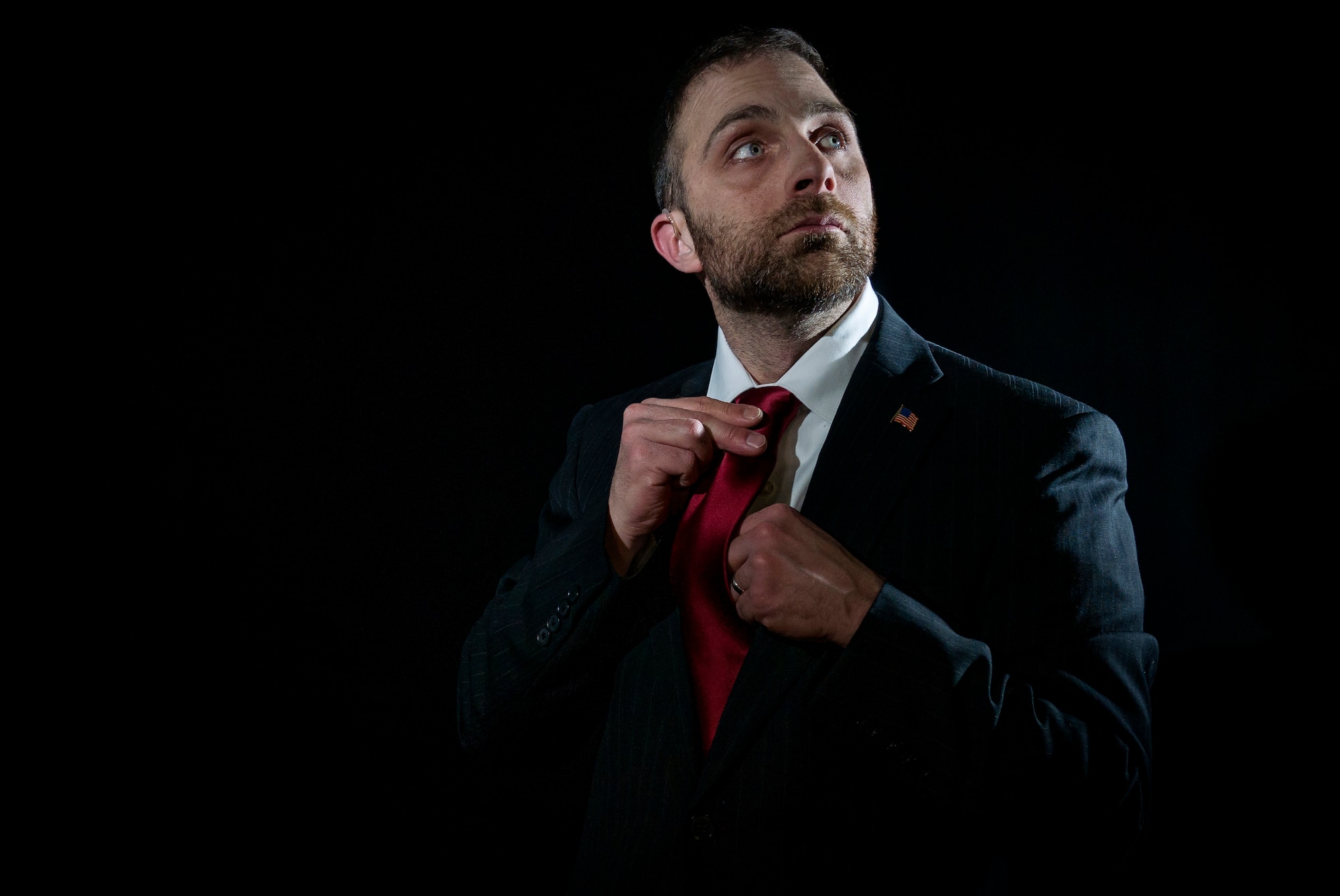 Justin Connaher, a public affairs specialist poses wearing the suit he wore on his first day of his first federal job. Connaher served as a U.S. Army parachute infantryman from 1994 to 1997 and, as a disabled veteran, received a 10-point veteran's preference for hiring. (U.S. Air Force photo by Airman 1st Class Kyle Johnson/Released)