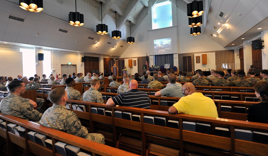 Service members and civilians  attend the memorial of Military Working Dog Rob at Chapel 1, Feb. 10, 2016, at Kadena Air Base, Japan. Approximately 100 people from Kadena and other U.S branch of officials attended the Rob's memorial. (U.S. Air Force photo by Naoto Anazawa)