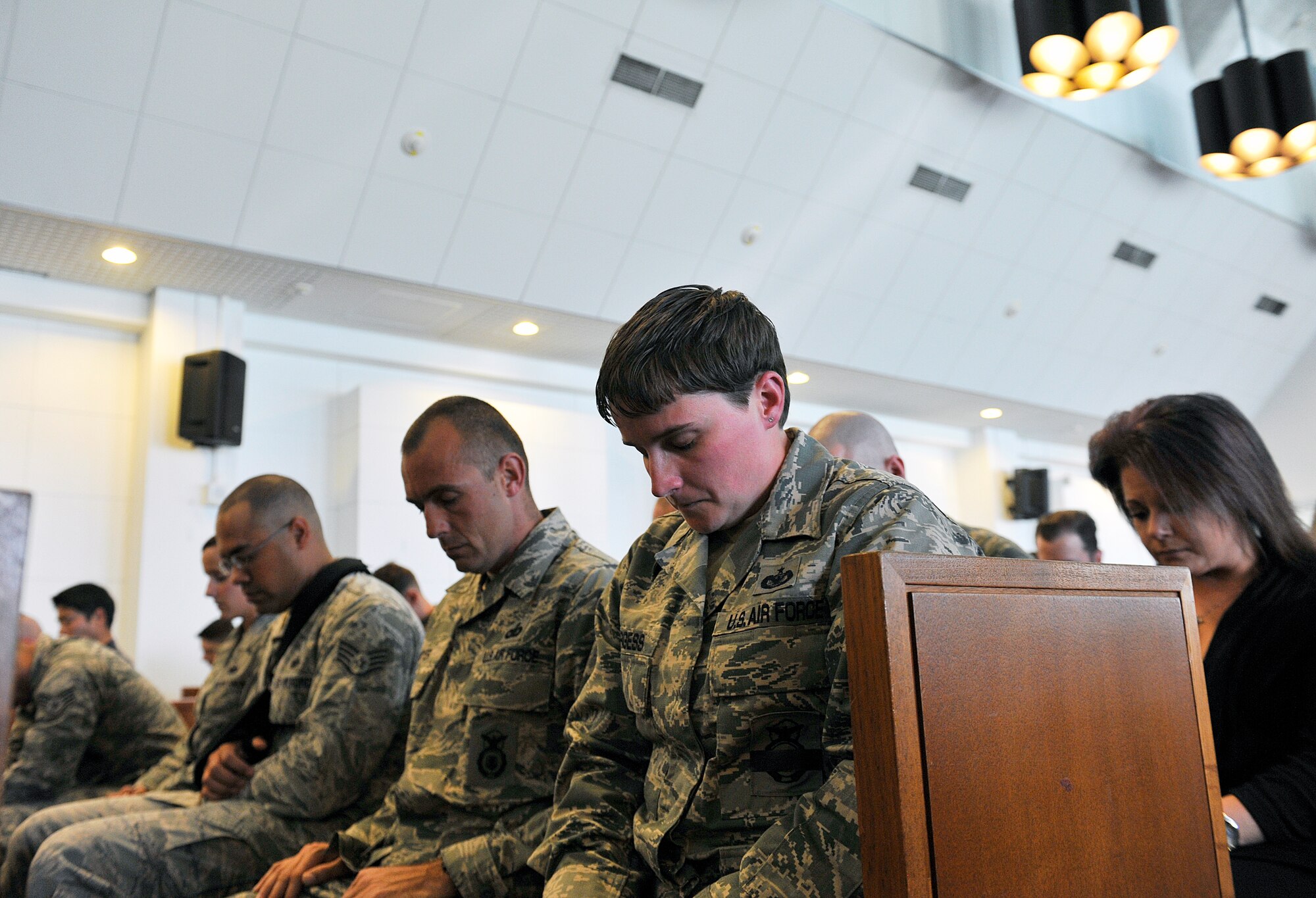 U.S. Air Force Airmen observe a moment of silence for Military Working Dog Rob during a memorial at Chapel 1, Feb. 10, 2016, at Kadena Air Base, Japan. Rob, who served for more than three years with the U.S. Air Force as a patrol explosive detection dog, passed away Jan. 7, 2016. (U.S. Air Force photo by Naoto Anazawa)
