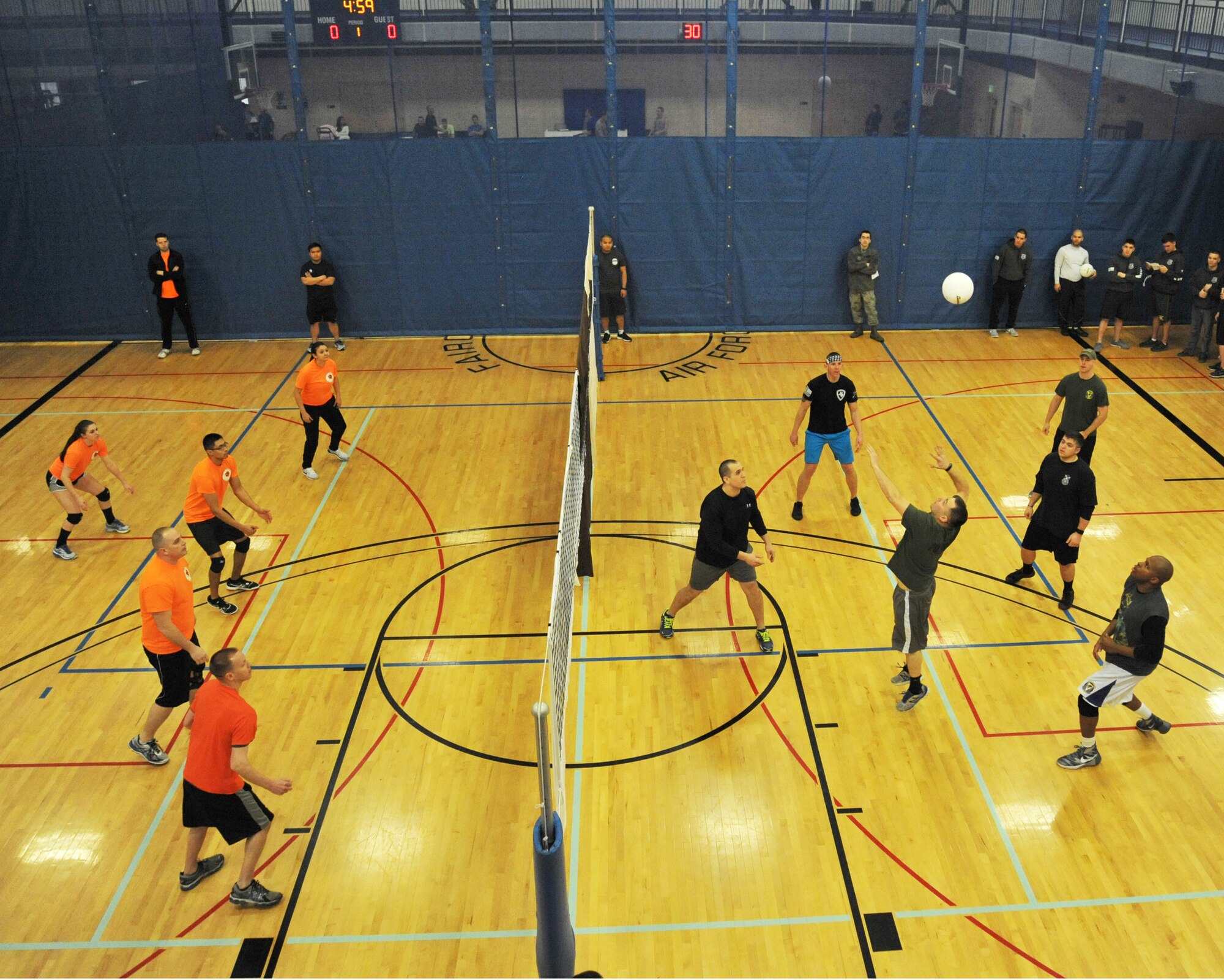 Members from the 92nd Civil Engineer Squadron compete against members of the 92nd Security Forces Squadron during a volleyball tournament as part of Winter Sports Day Feb. 12, 2016, at Fairchild Air Force Base, Wash. Fairchild hosted a Winter Sports day for Airmen to compete in sports and build unit morale. 
(U.S. Air Force photo/Staff Sgt. Samantha Krolikowski)
