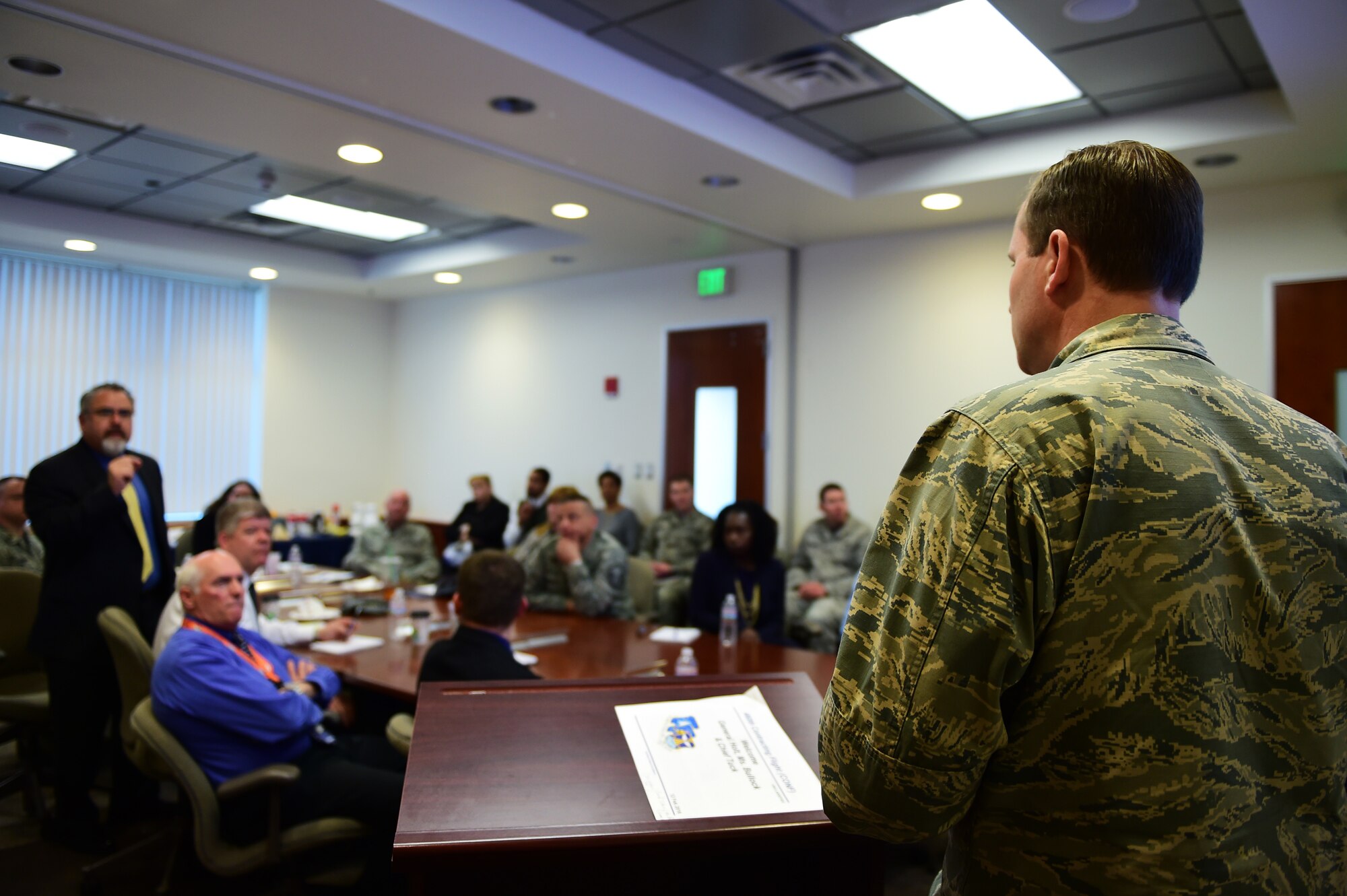U.S. Air Force Brig. Gen. Cameron Holt, Air Force Installation Contracting Agency commander, answers questions during a town hall and career perspective brief Feb. 12, 2016, on Buckley Air Force Base, Colo. The AFICA leaders touched base with members to gain insight about daily operations, shared words of wisdom and clarified mission projection. (U.S. Air Force photo by Senior Airman Racheal E. Watson/Released)