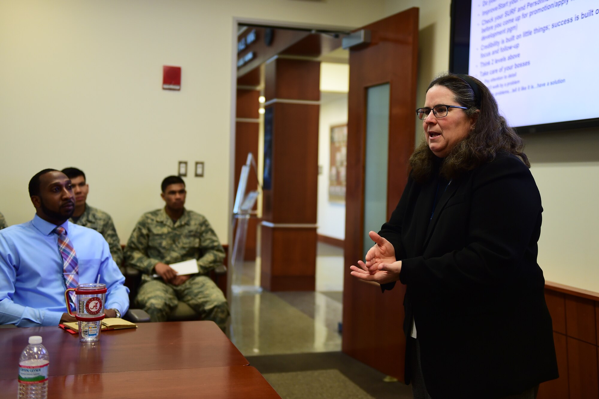 Heidi Bullock, Air Force Installation Contracting Agency executive director, shared her lessons learned to a contracting team during a visit Feb. 12, 2016, on Buckley Air Force Base, Colo. The AFICA leaders touched base with members to gain insight about daily operations, shared words of wisdom and clarified mission projection. (U.S. Air Force photo by Senior Airman Racheal E. Watson/Released) 