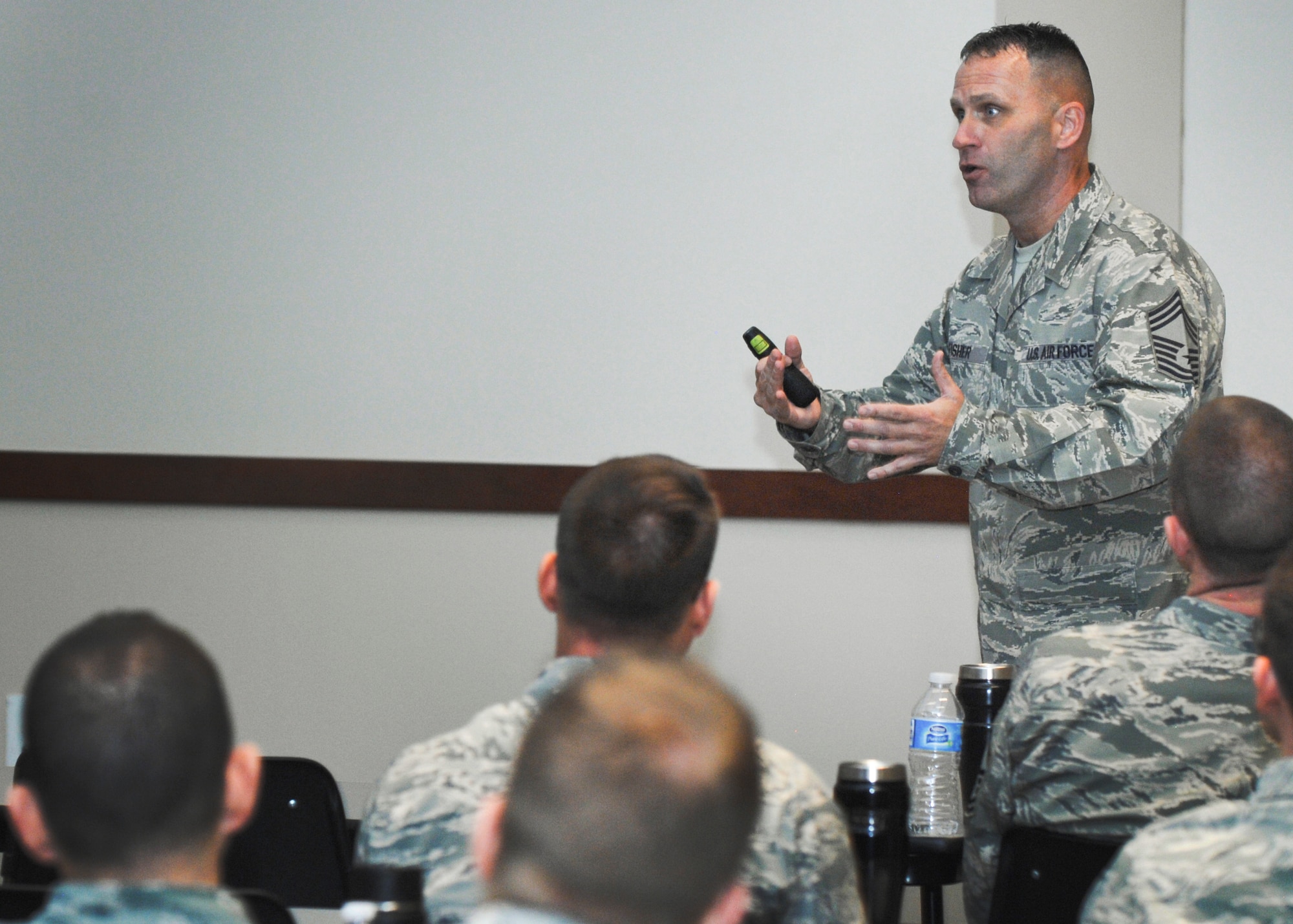 Chief Master Sgt. Anthony Fisher, Profession of Arms Center of Excellence superintendent, briefs members of Team Buckley during an Enhancing Human Capital course Feb. 12, 2016, at Buckley Air Force Base, Colo. Focused on reaching Air Force leaders at all levels, the course covered various topics, including the attributes and dangers of personal bias, phenomenon of entrenched thinking, mandate verses organic leadership skills and gave tools people can use to develop productive, healthy relationships at work and at home. (U.S. Air Force photo by Staff Sgt. Katrina M. Brisbin/Released)