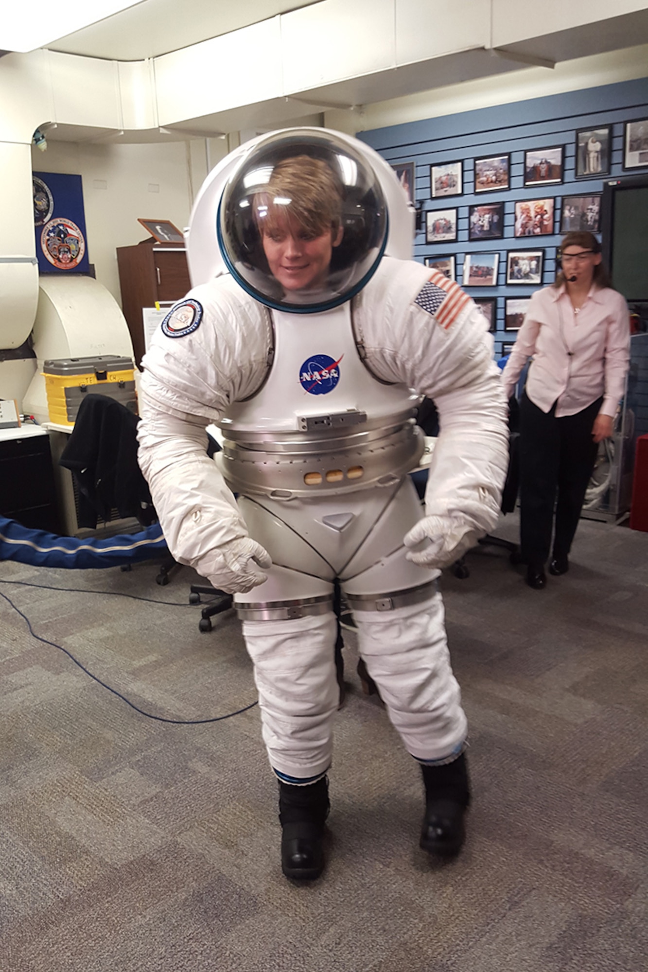 HOUSTON - U.S. Army Astronaut Maj. Anne McClain demonstrates mobility in a prototype Mark III spacesuit Feb. 9 at NASA's Johnson Space Center in Houston, Texas. The Army astronaut detachment is part of the U.S. Army Space and Missile Defense Command/Army Forces Strategic Command. (photo by Dottie K. White)