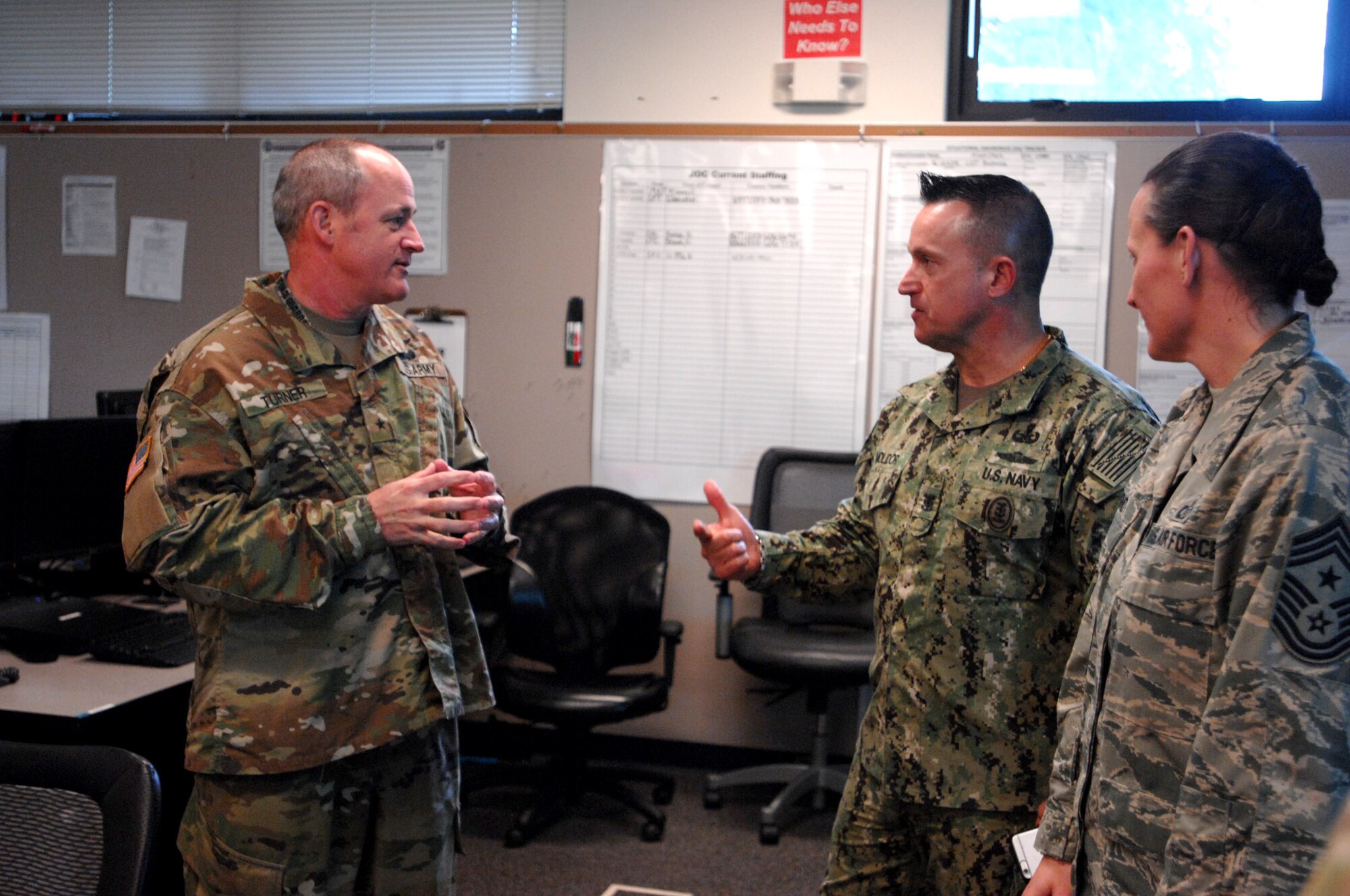 Fleet Master Chief Terrence Molidor, North American Aerospace Defense Command and U.S. Northern Command command senior enlisted leader, speaks with Army Brig. Gen.  Wallace Turner, Deputy Adjutant General for Washington, and Command Chief Master Sgt. Trisha Almond, Jan. 27, in Tacoma, WA.  Molidor, along with eight other senior enlisted leaders from the command met with leadership at Joint Base Lewis McChord, the Washington and Oregon National Guards, emergency managers and Navy Command Northwest learning how their day-to-day missions and emergency plans align with USNORTHCOM. Photo by Air Force Master Sgt. Chuck Marsh/Released.
