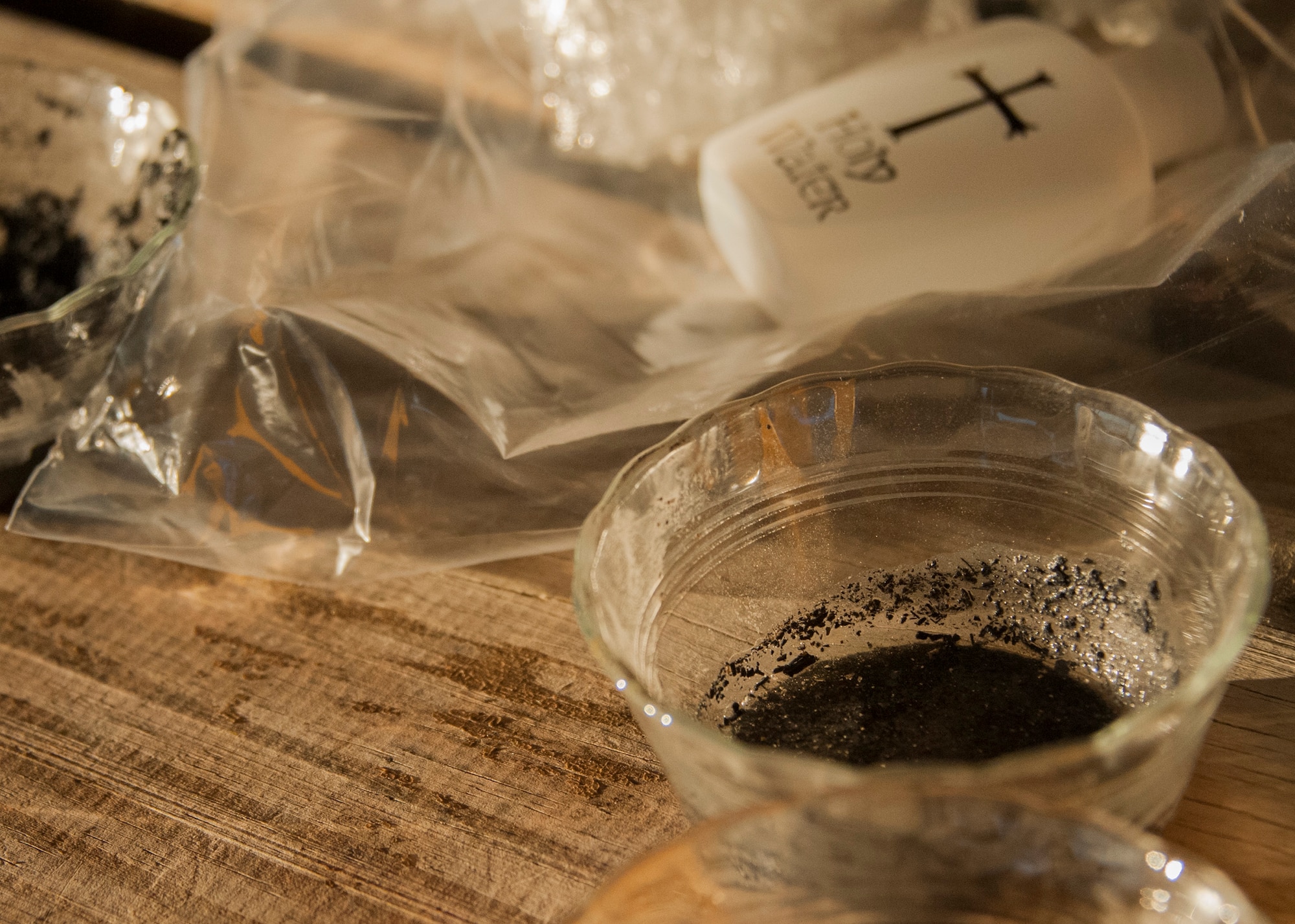 A bowl of ashes marks the optional little black cross of ashes received by 5K participants during the Ash Wednesday 5K Feb. 10 at Eglin Air Force Base, Fla. Approximately 115 runners and 15 volunteers endured a 29-degree temperature to participate in the run. Ash Wednesday marks the beginning of the Lent season for Christians. (U.S. Air Force photo/Ilka Cole)