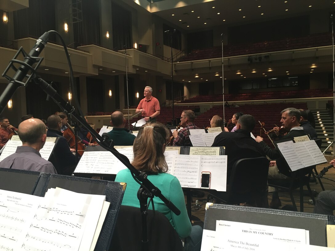 Colonel Larry Lang leads the Air Force Orchestra in a recording session at Schlesinger
Concert Hall in Alexandria, Virginia.  The music will be featured as part of the Macy's Fourth of July Fireworks display and NBC television broadcast in New York, New York this summer.  (U.S. Air Force Photo by Technical Sgt. Sara Wollmacher/released)
