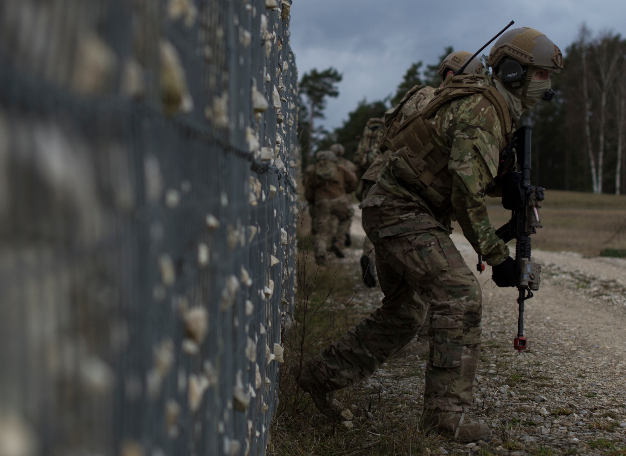 An Airman with the 2nd Air Support Operations Squadron, maneuvers to the objective during training at U.S. Army Garrison Bavaria in Vilseck, Germany, Feb. 9, 2016. The training consisted of 2nd ASOS Airmen calling in close air support, neutralizing opposing forces and practicing medical evacuation by helicopter. The Airmen swapped roles as opposing forces and U.S. forces throughout the training to challenge their capabilities in controlling air power in an urban environment. (U.S. Air Force photo/Senior Airman Jonathan Stefanko)