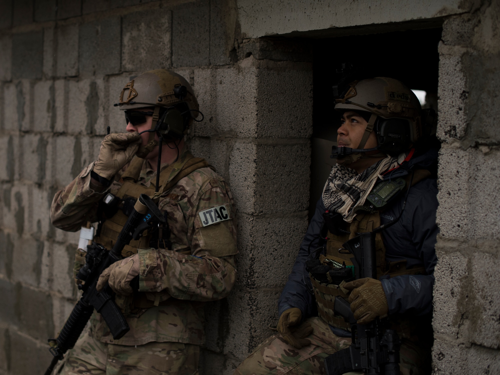 Senior Airman Logan Bennett, 2nd Air Support Operations Squadron joint terminal attack controller, and Senior Airman Ericson Galinato, 2nd ASOS tactical air control party, discuss their plan of attack during training at U.S. Army Garrison Bavaria in Vilseck, Germany, Feb. 9, 2016. The training consisted of 2nd ASOS Airmen calling in close air support, neutralizing opposing forces and practicing medical evacuation by helicopter. (U.S. Air Force photo/Senior Airman Jonathan Stefanko)