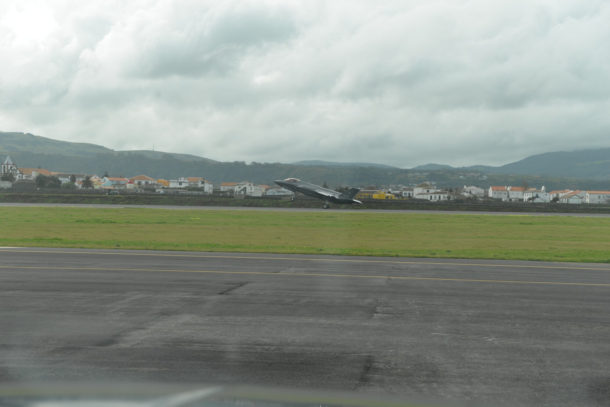 Air Force F-35A Lightning II lands at Lajes Field, Azores Portugal February 3, 2016. The Italian F-35A Lightning II refueled at Lajes Field on the first trans-Atlantic Ocean crossing from Cameri, Air Base Italy to Naval Air Station Patuxent River, Md., Feb 3-5. (U.S. Air Force photo by Ricky Baptista/Released) 